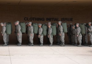 Trainees with their initial clothing issue on their backs.  (Photo: Robert Rubio/Air Force)